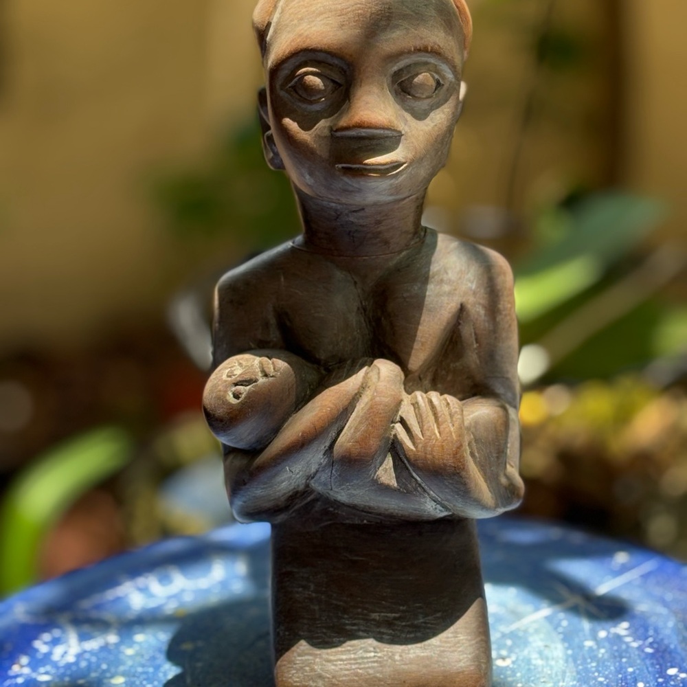 African Tribal art. Father with baby. Carved wood.